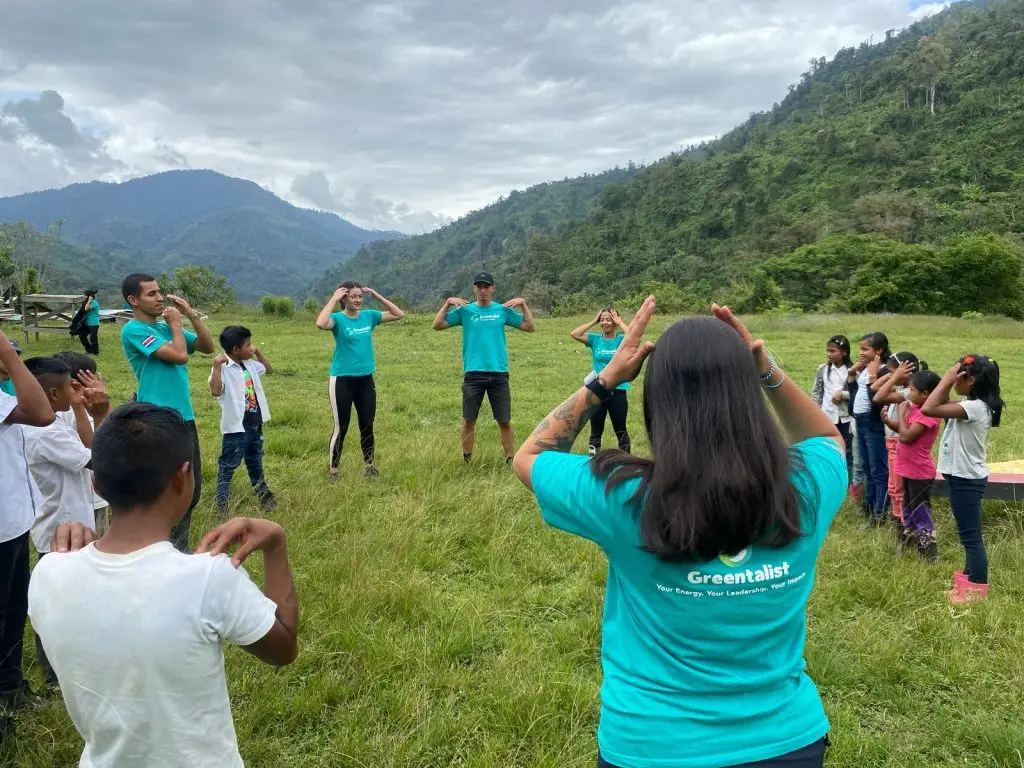 Greentalist volunteers leading a group of children in an Tolok Kicha School in the Cabecar Territory Costa Rica