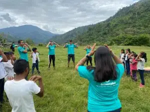 Greentalist volunteers leading a group of children in an Tolok Kicha School in the Cabecar Territory Costa Rica