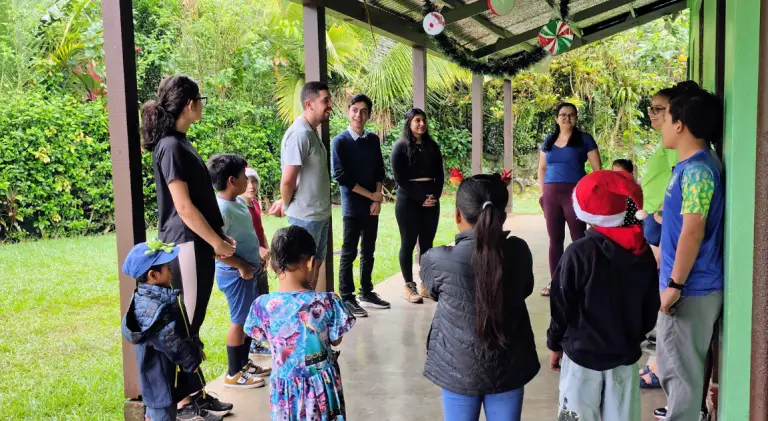 Volunteers and students interacting during an environmental education activity in a rural school in Turrialba Costa Rica